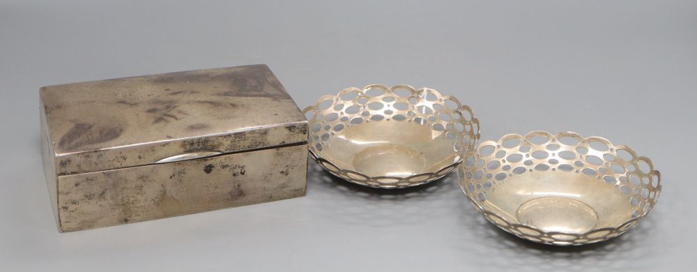 A pair of silver bon-bon dishes, A & J Z, Birmingham 1910, 5.1oz. and a Chinese white metal cigarette box marked LH 90, 16cm (3)